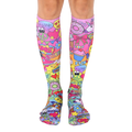 Pair of knee-high socks. Pink base with colorful cartoon designs, including unicorns, cupcakes, and peace signs. [lf]