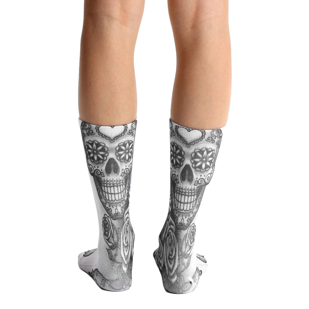 Back view of Dia socks showcasing the full sugar skull design. [lf]