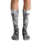 A pair of white crew socks with a gray sugar skull and rose design. The skulls have floral details. [lf]