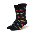 A pair of black crew socks with a pattern of colorful dinosaurs in red, yellow, blue, and green.