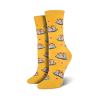 A pair of women's crew socks in mustard yellow. The socks are adorned with a pattern of illustrated pancakes, hearts, and syrup drizzles.
