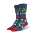 A pair of navy blue crew socks with a repeating pattern of red and green reindeer and white snowflakes. The socks have red toes and heels.