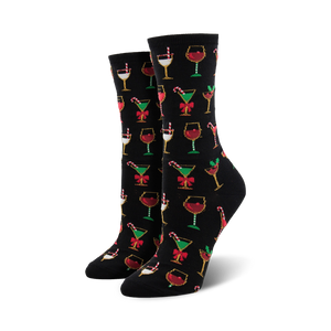 Crew socks in black with a colorful Christmas cocktail pattern. Red, green, gold, and white glasses with candy canes and bows are featured on the black background.