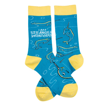 Crew socks in teal blue with yellow cuffs.  Narwhal pattern and the text 'I am strange & wonderful'.
