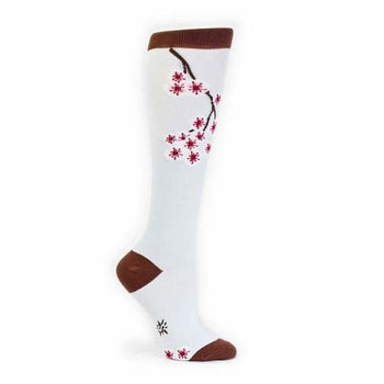 White knee-high socks with a brown cuff and a design of a cherry blossom branch with dark pink flowers.